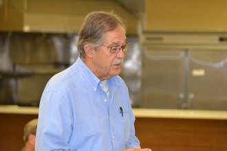 Candidates share views with approximately 50 residents at Senior Center forum Longtime Kings County resident Jerry Irons asks candidates a question.